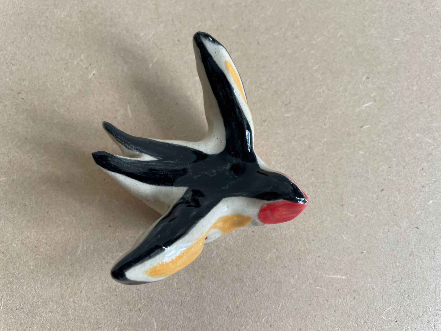 Zwaluw zwart geel rood (maat S)